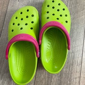 Green and pink crocs
